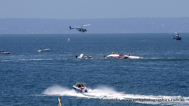 'Qatar 96' upside down after crashing out on a bouy turn - fortunately, throttleman Steve Curtis and driver Ali Al-Neama escaped injury. © Reg Blunt http://www.embphotographics.com.au